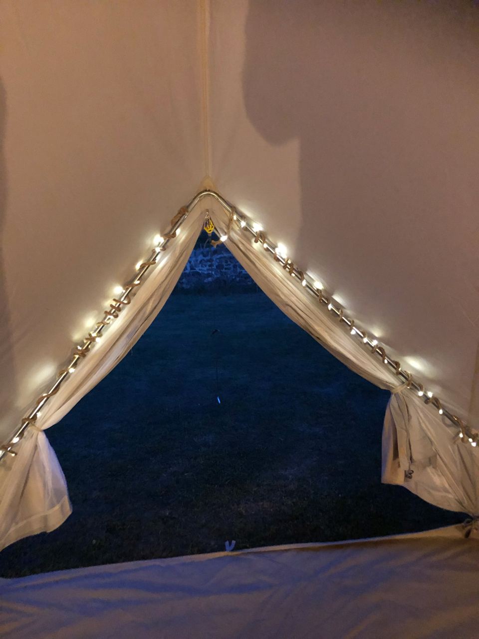 Bell tent doorway with fairy lights