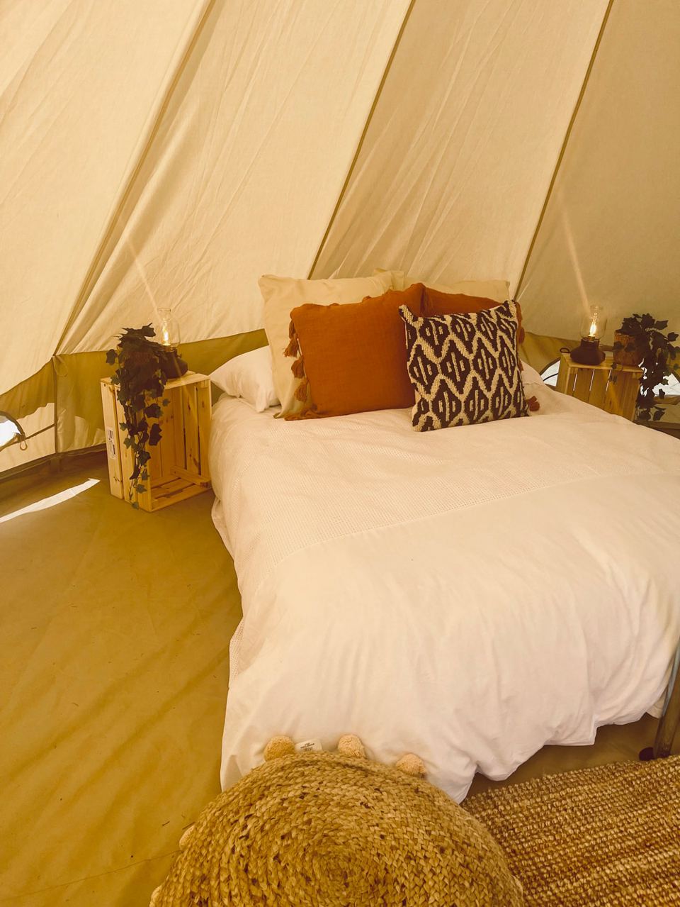 Double bed inside a bell tent