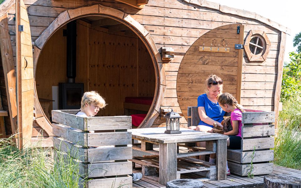 Family outside a Hoglet House