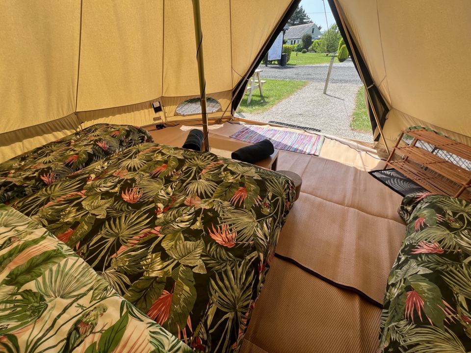 Inside the bell tent with bed