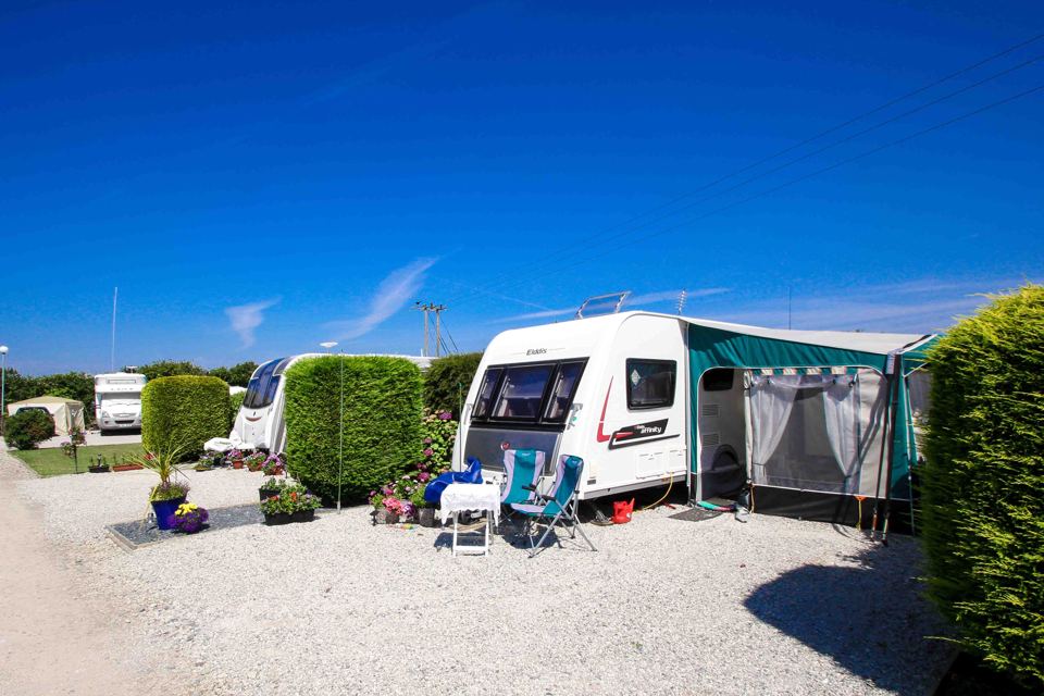 Caravan with awning on gravel