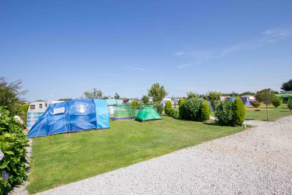Grass pitches beside the gravel track