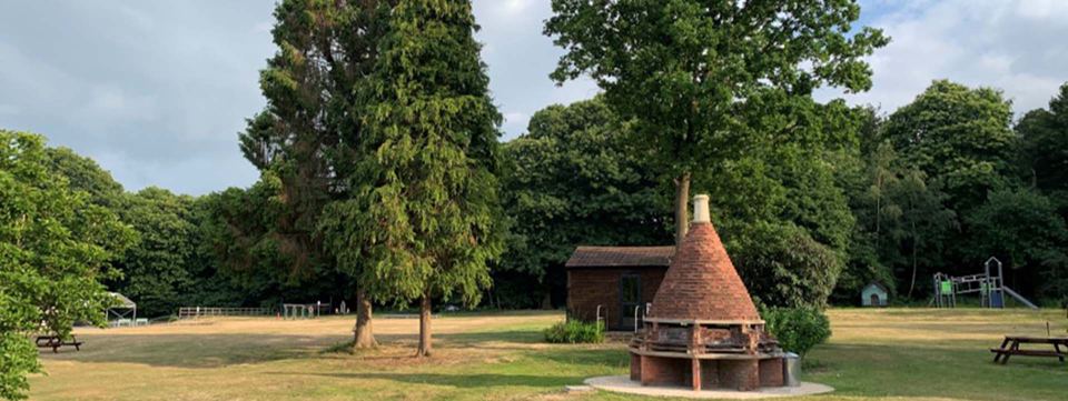 Open grass and covered barbecue hut
