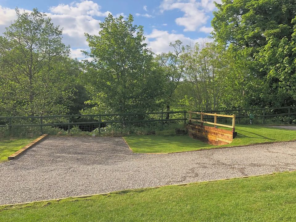 Gravel pitch by the wooden bridge