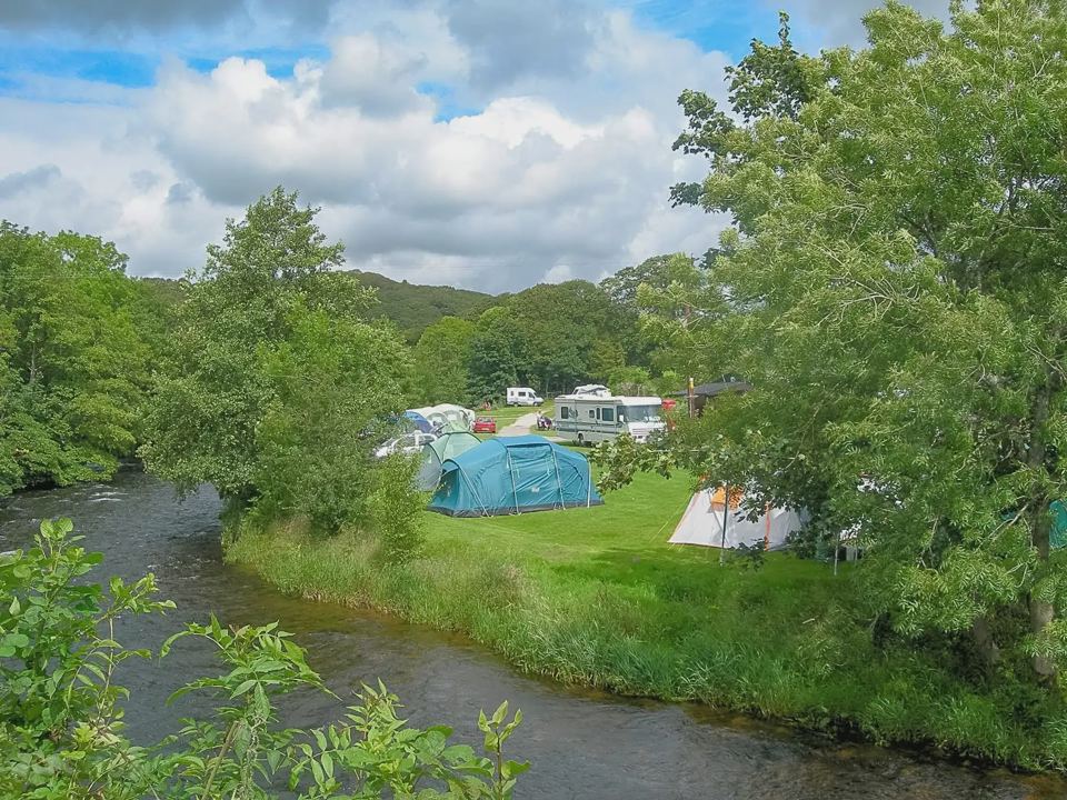 Tents beside the river