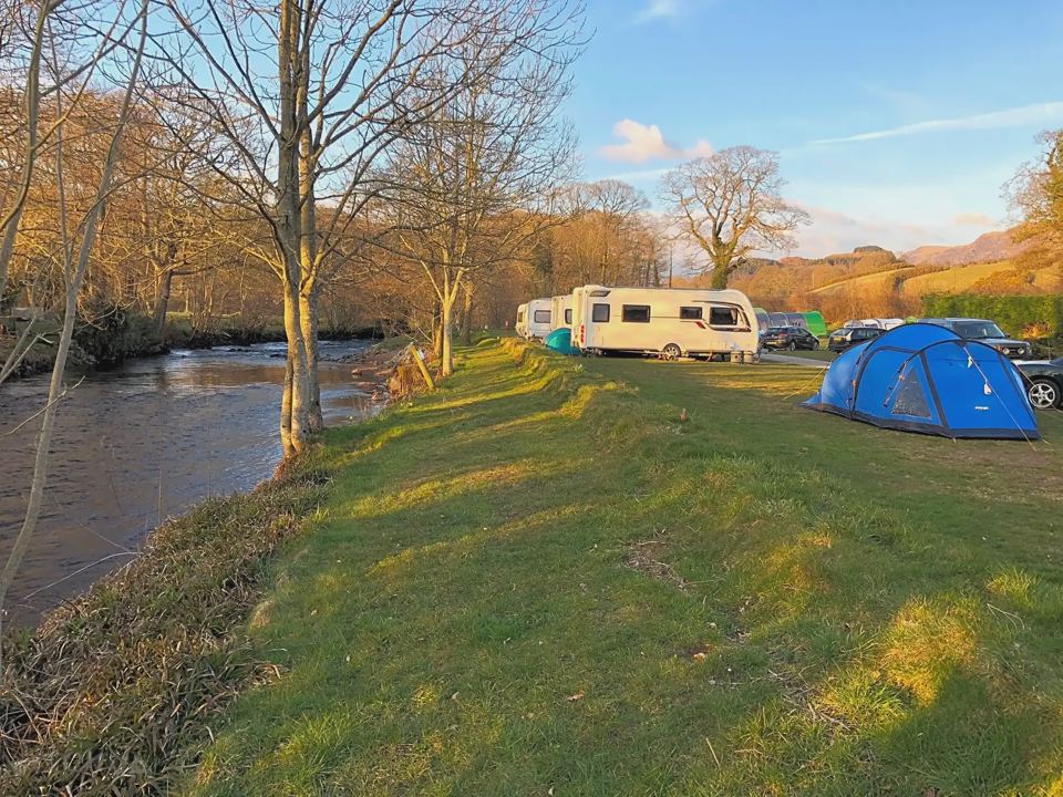 Touring pitches beside the river