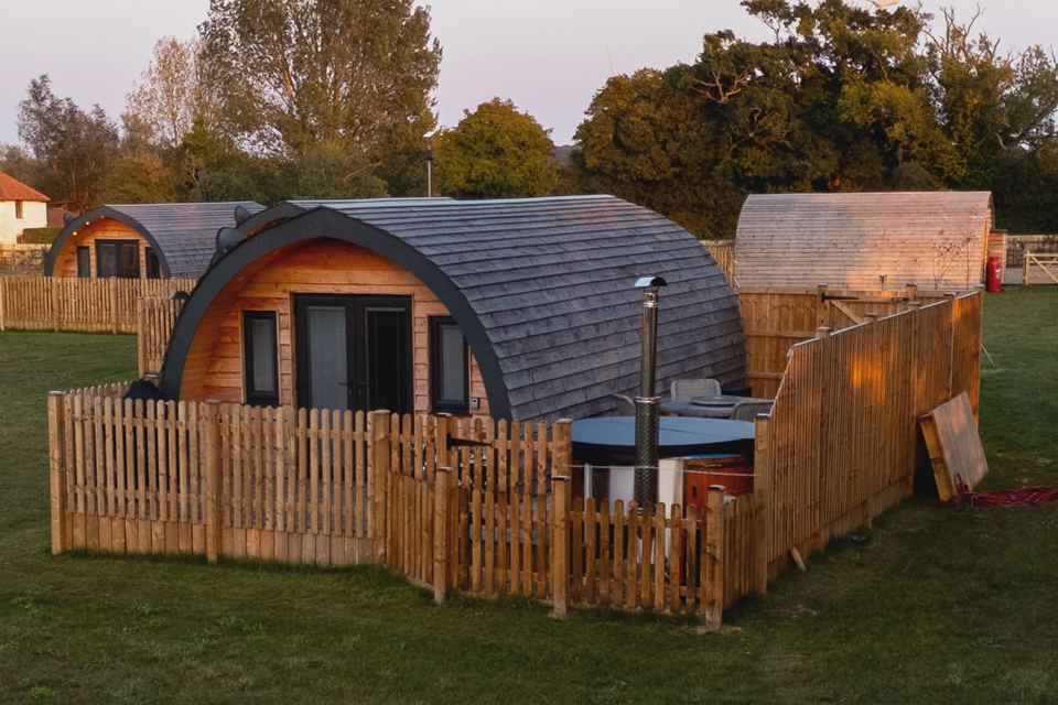 Pod with fenced hot tub terrace