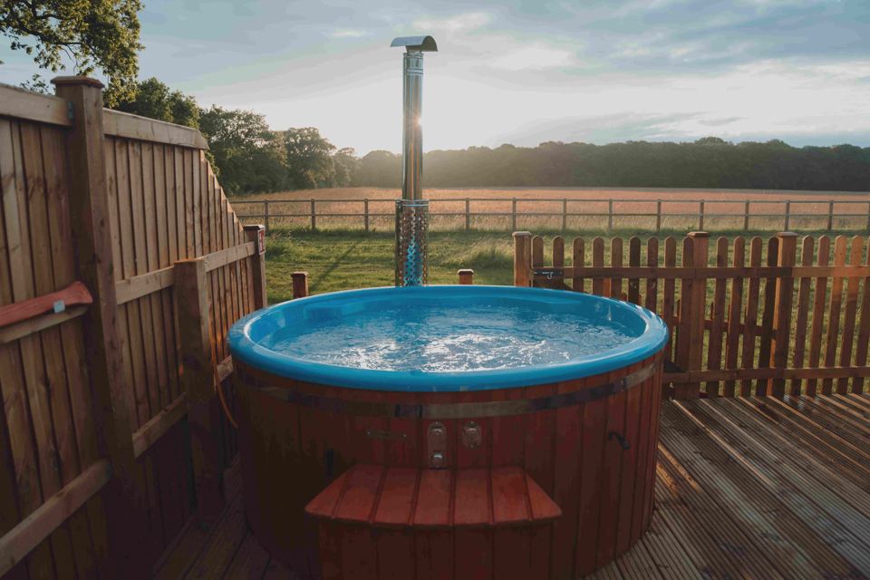 Wood-fired hot tub at sunset