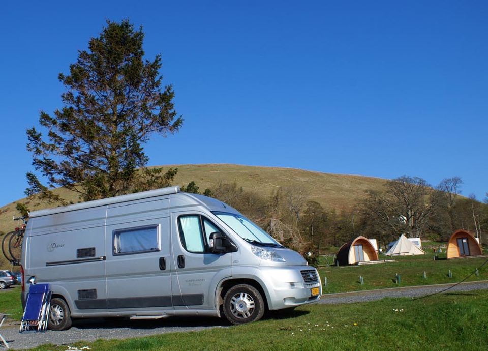 Motorhome beside the bell tents