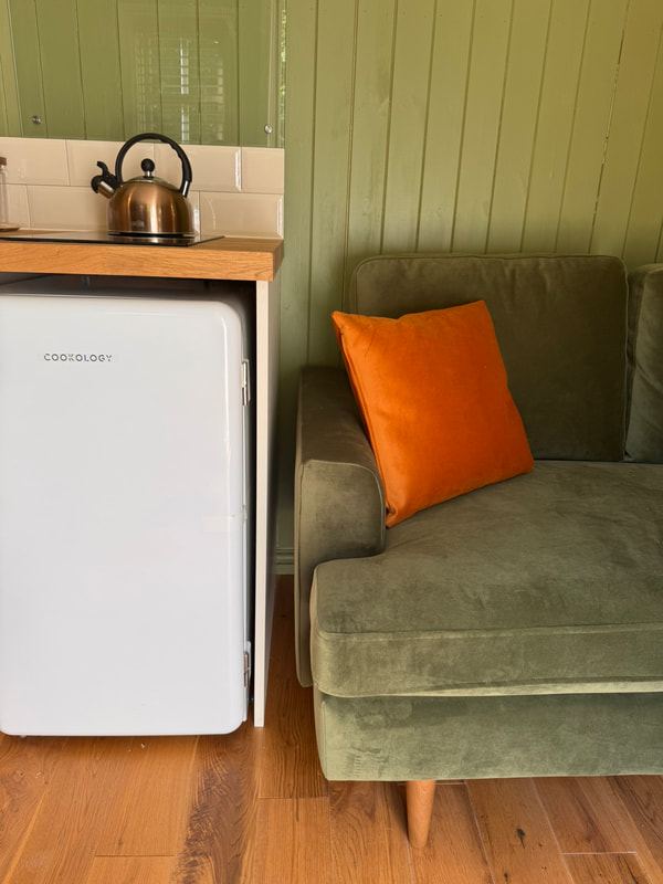 Kitchenette and sofa inside