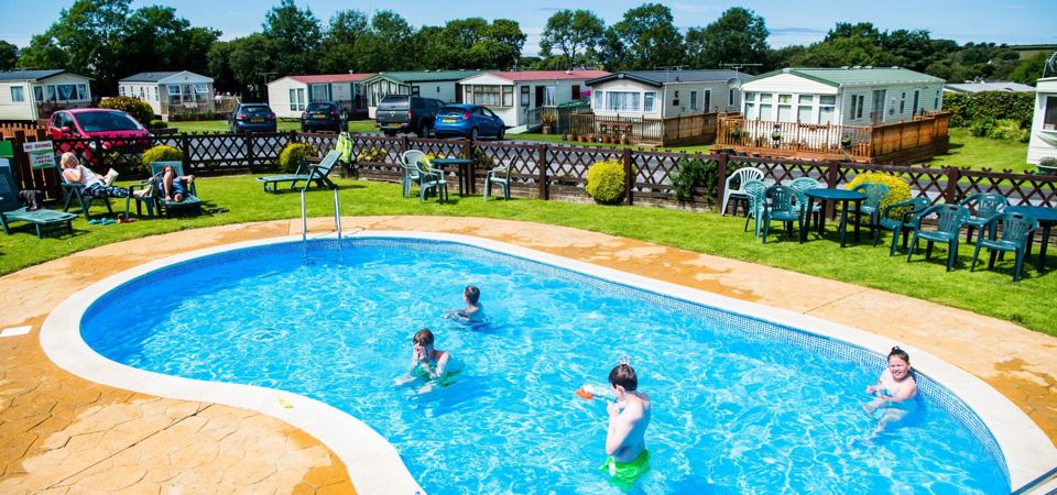 Outdoor pool beside the caravans