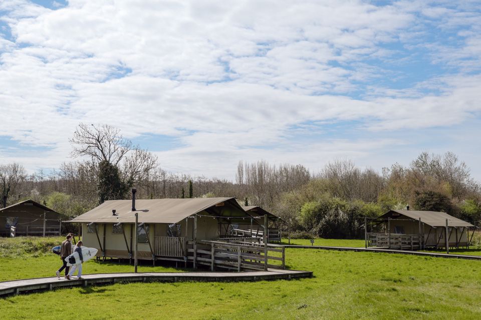 Safari tents by the field