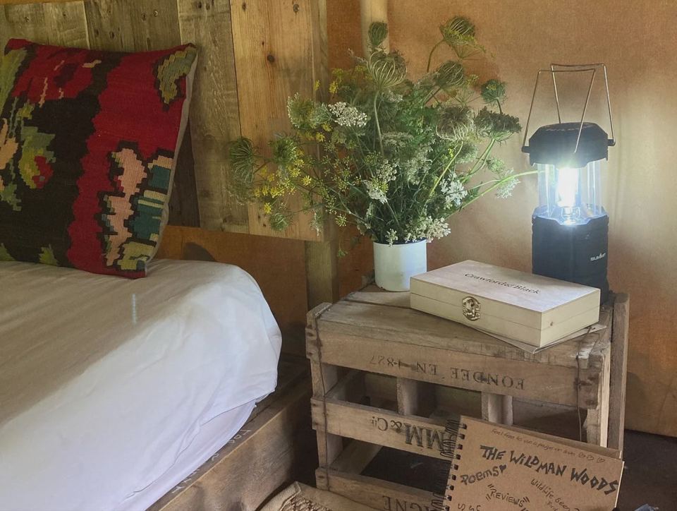 Bed inside a safari tent