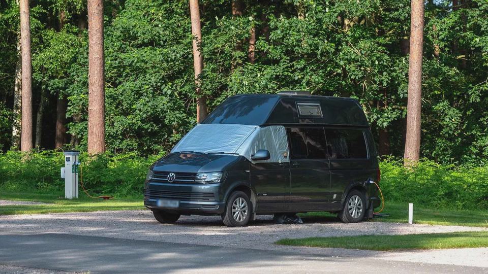 Campervan on a pitch with hook-up