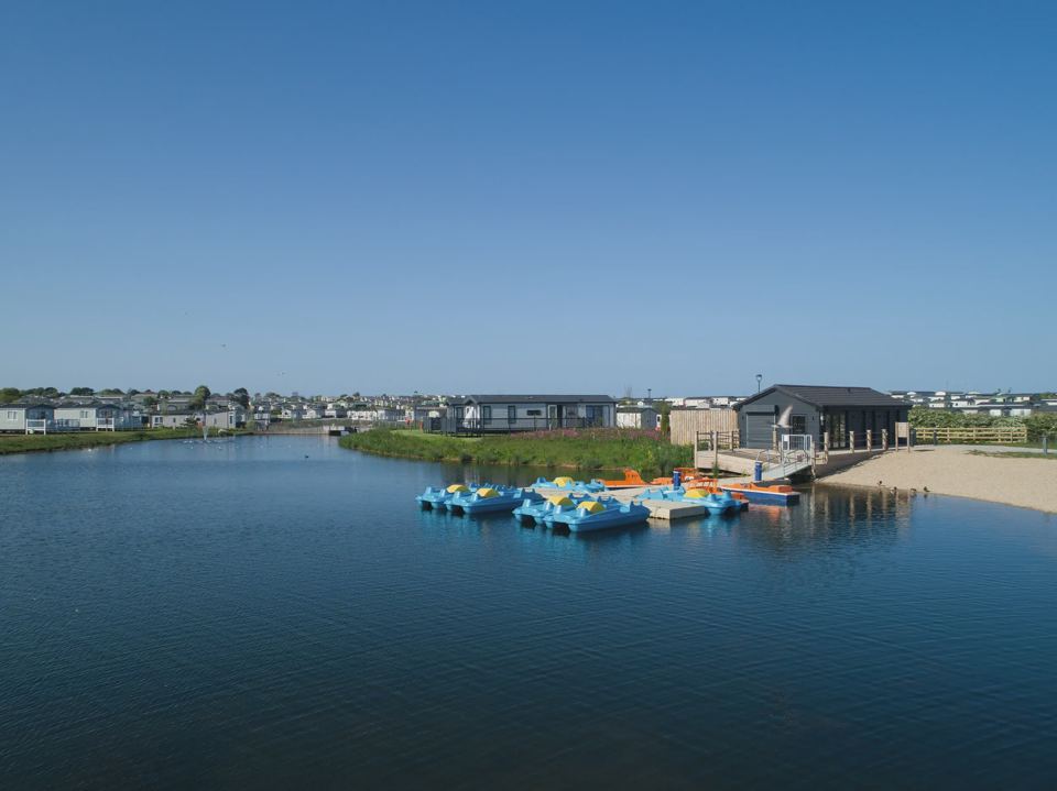 Lake with pedalos and beach