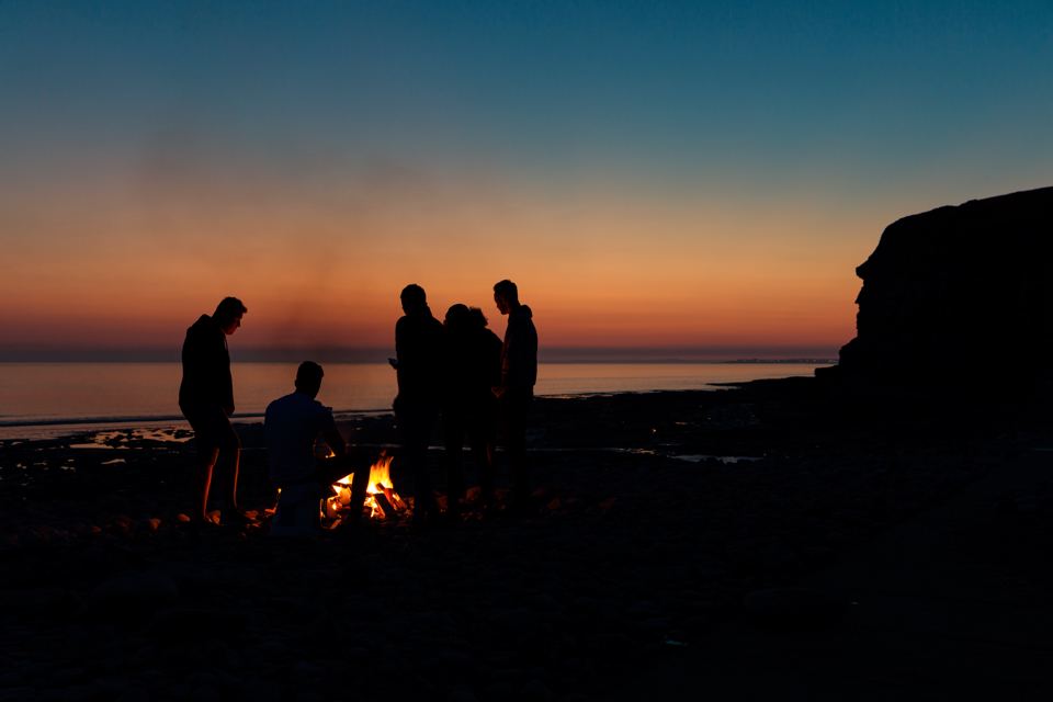 Fire on the beach at dusk