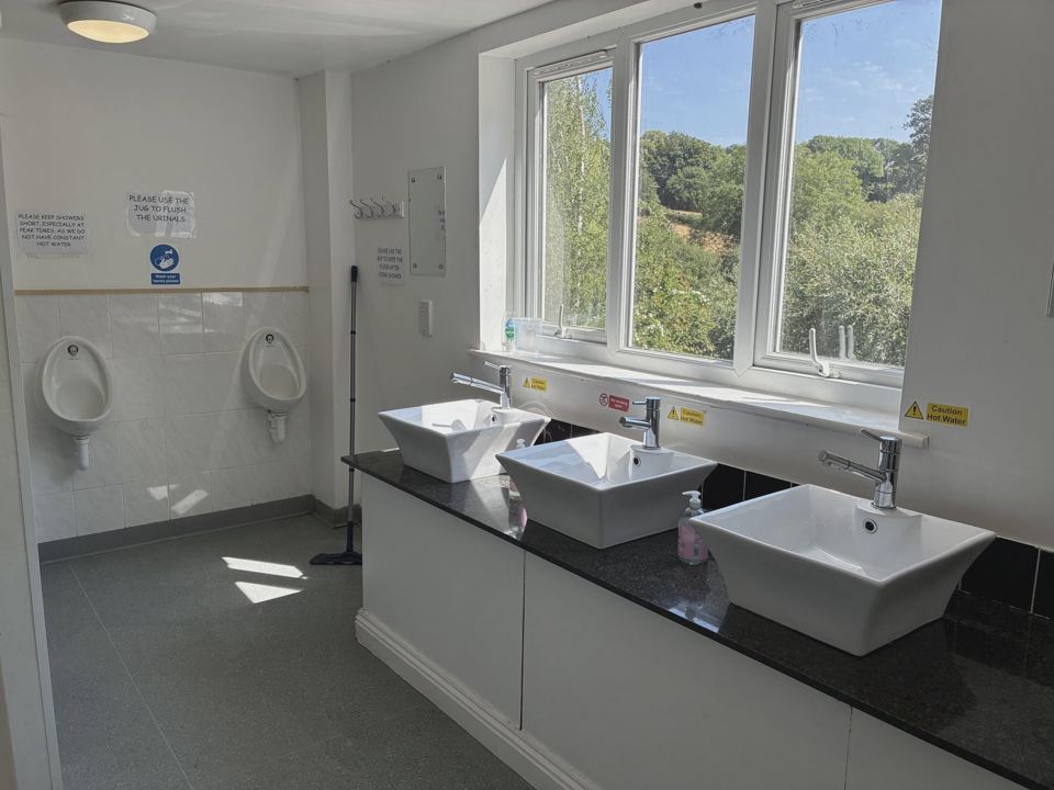 Washroom with basins and urinals
