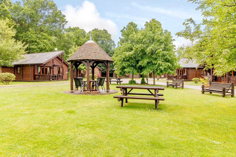 Lawn with gazebo between lodges