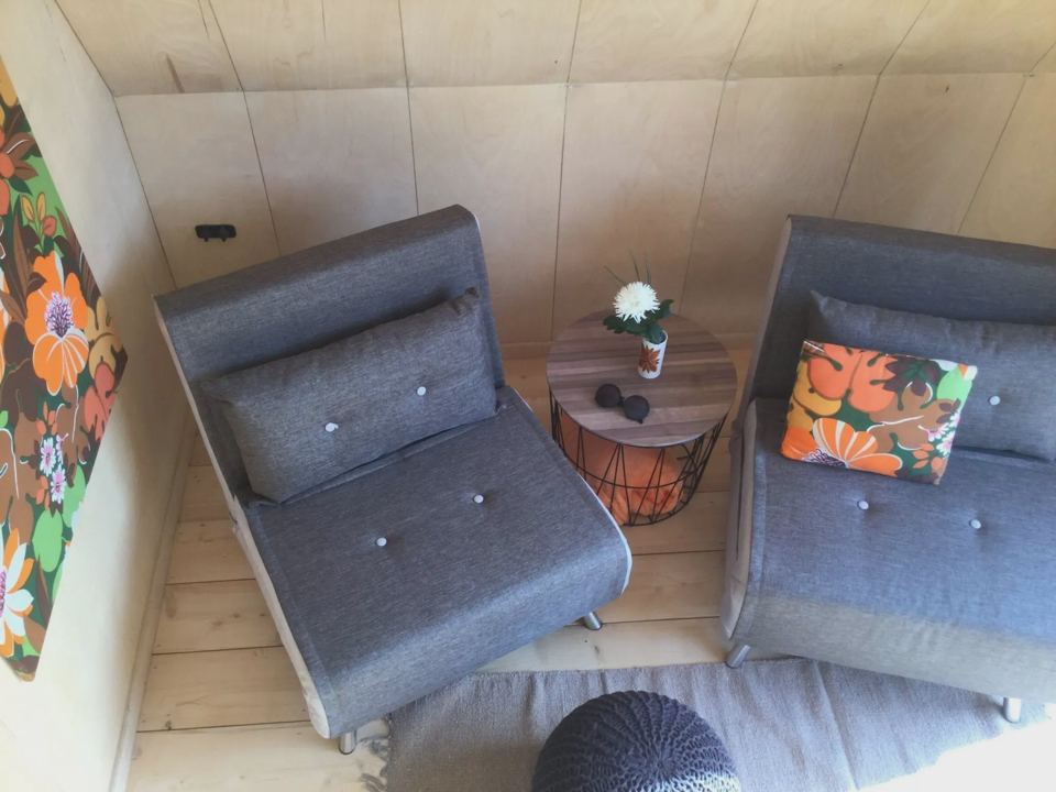 Two armchairs inside a cabin