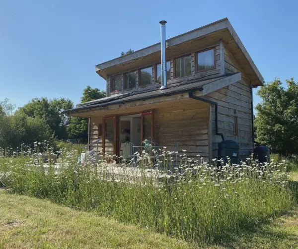 Two-storey cabin in long grass