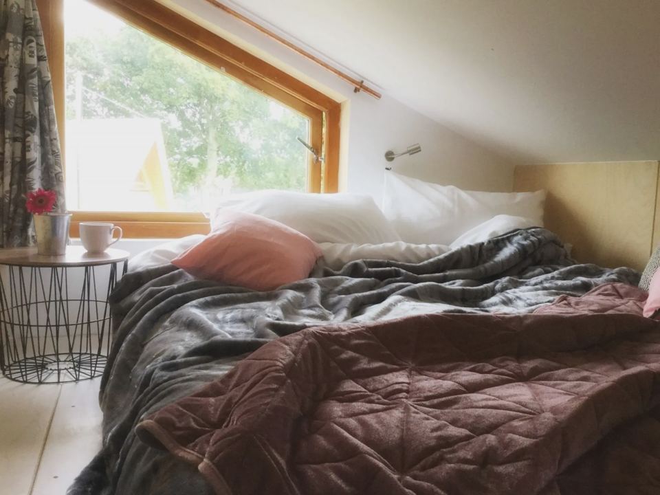 Bed by a big window