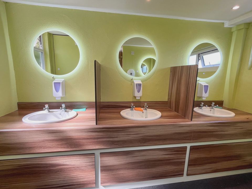 Washroom with round mirrors