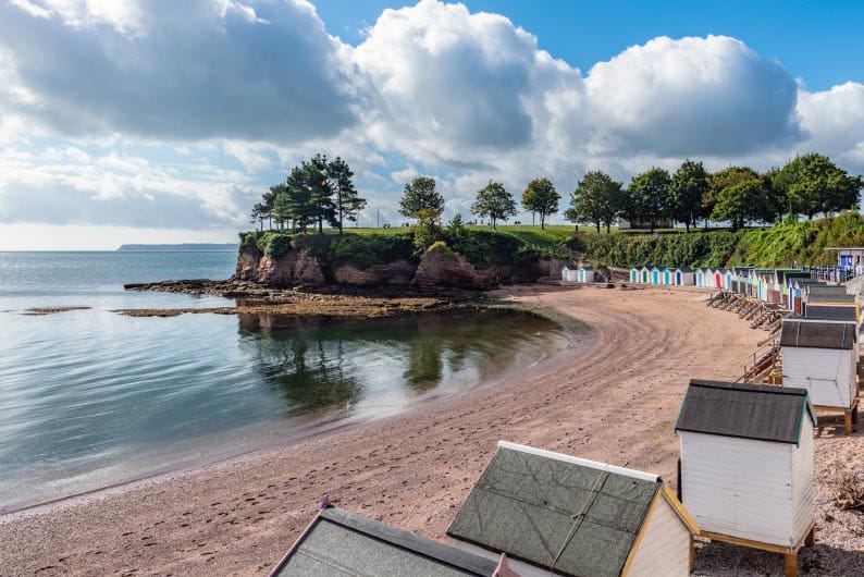 Beach and rocks with beach huts