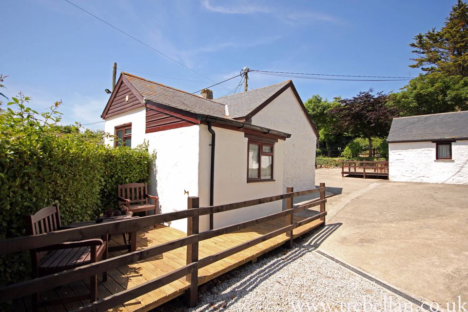 Cottage with decking and bench