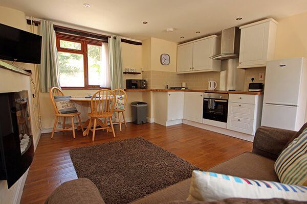 Lounge and kitchen with dining table