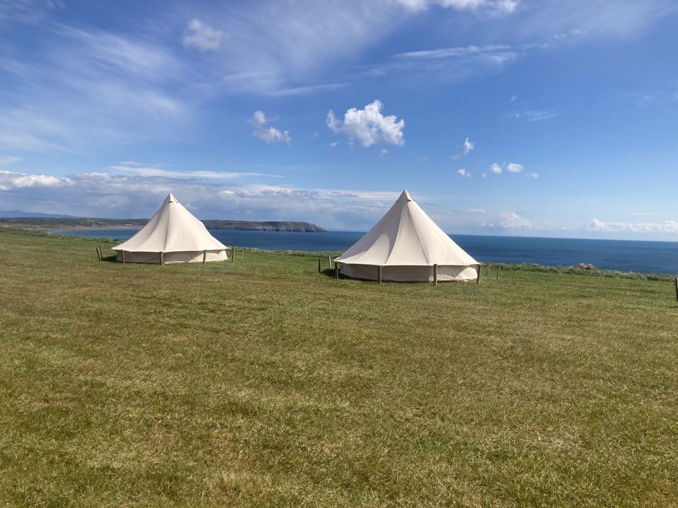 Bell tents on the clifftop