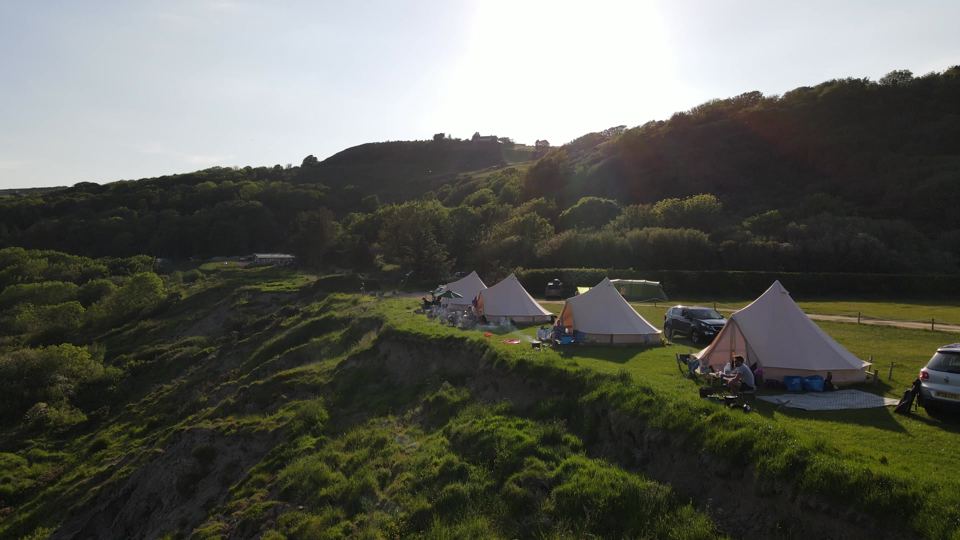 Bell tents on the cliff edge
