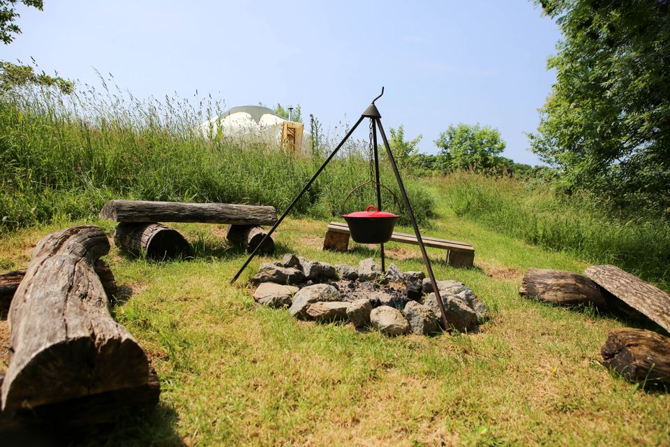 Fire pit beside log seats
