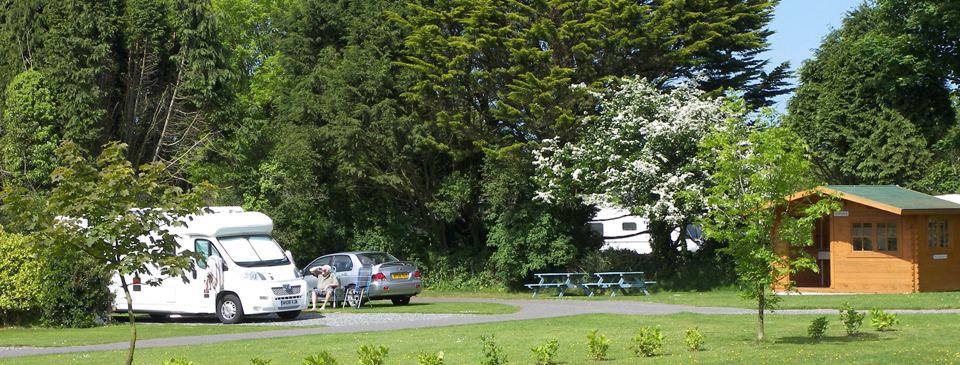 Wooden cabin beside the motorhome