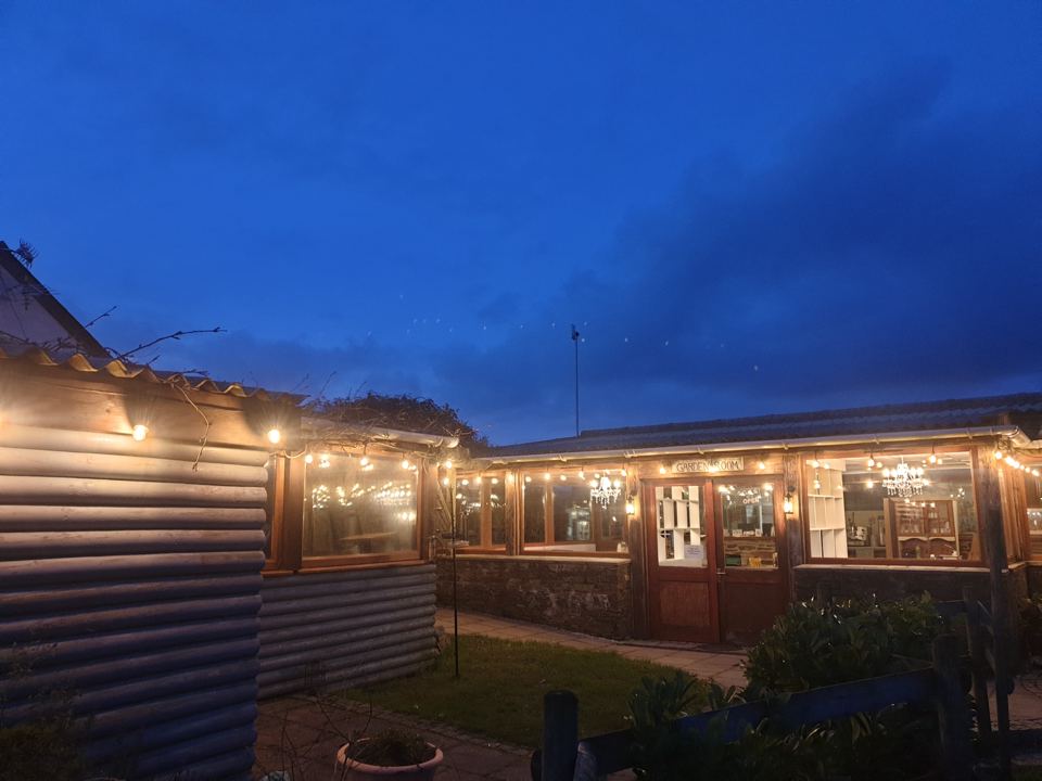 Bar lit up at dusk