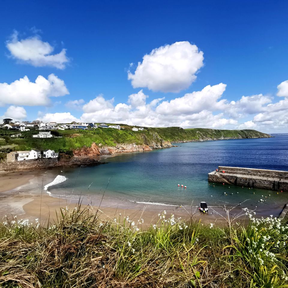 Cove beach with a pier
