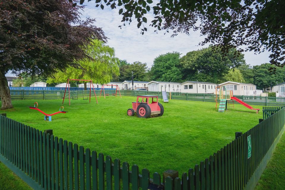 Fenced play area with tractor