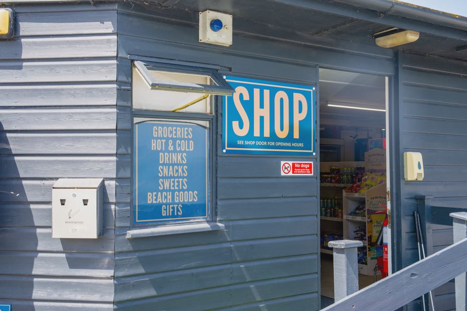 Shop front with groceries sign