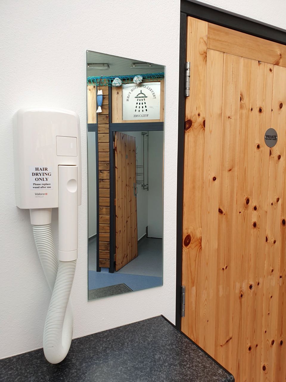 Cubicle door and hand dryer