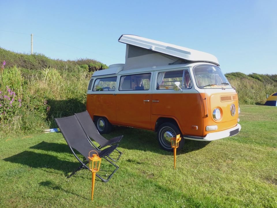 Orange campervan on the grass