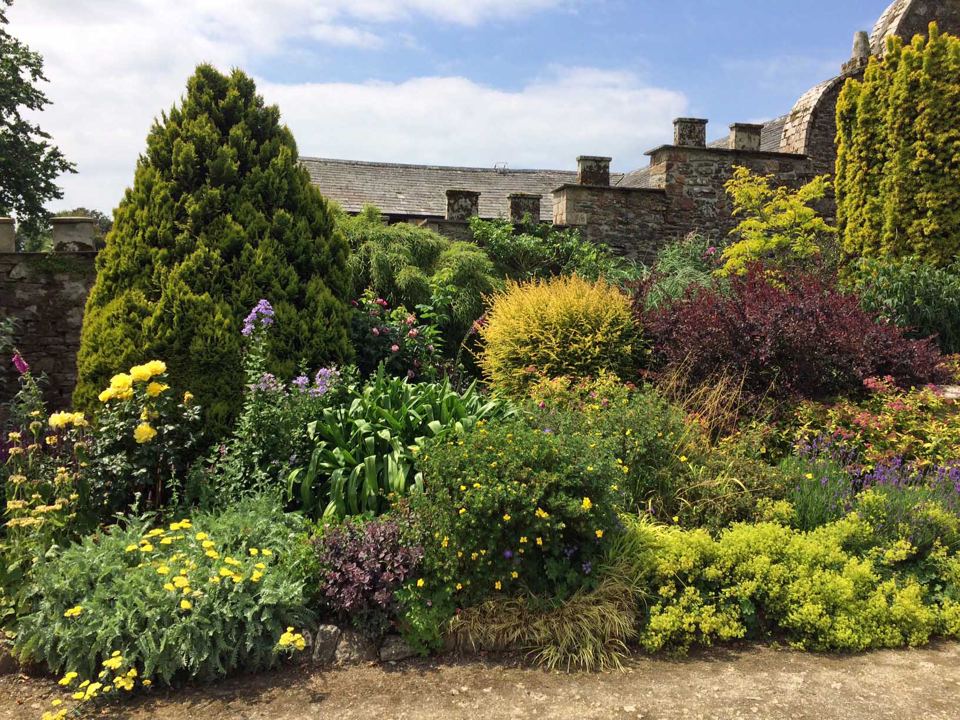 Walled garden with clipped trees