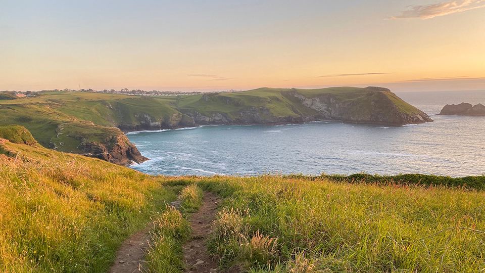 Coast path above the cove at sunset