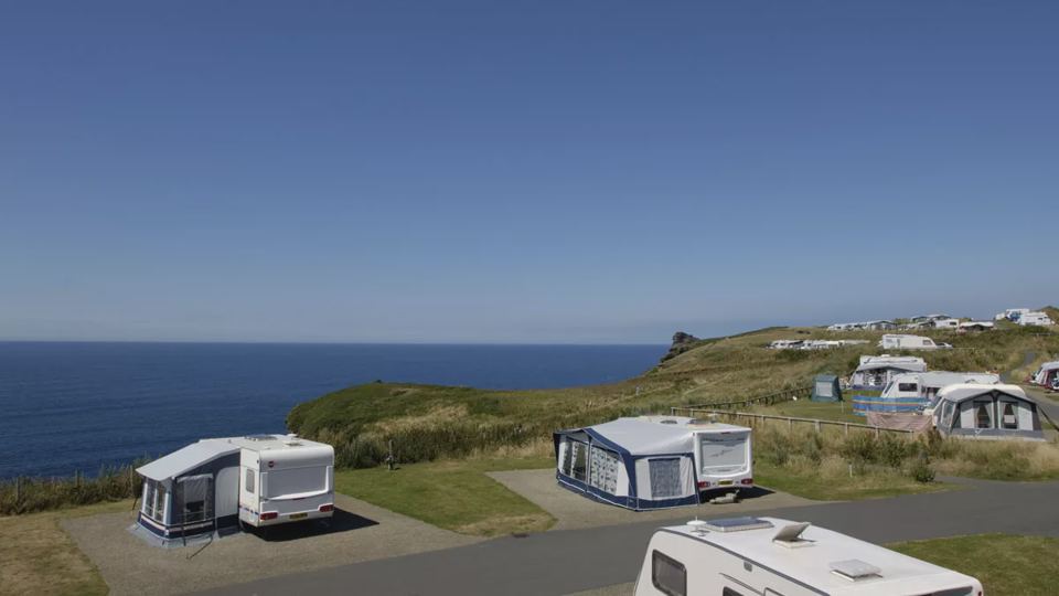 Caravans on pitches above the coast
