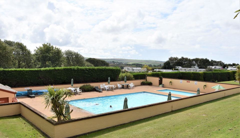 Outdoor pool with loungers