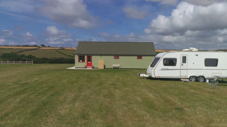 Caravan by the farm building
