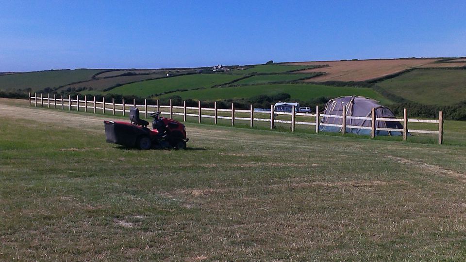 Tractor mowing beside the pitches