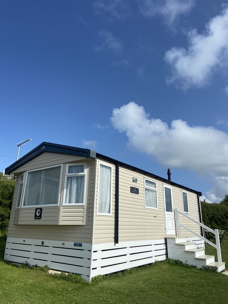 Static caravan exterior on grass