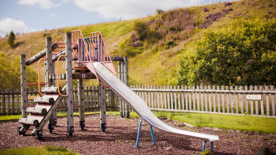 Play area with slide