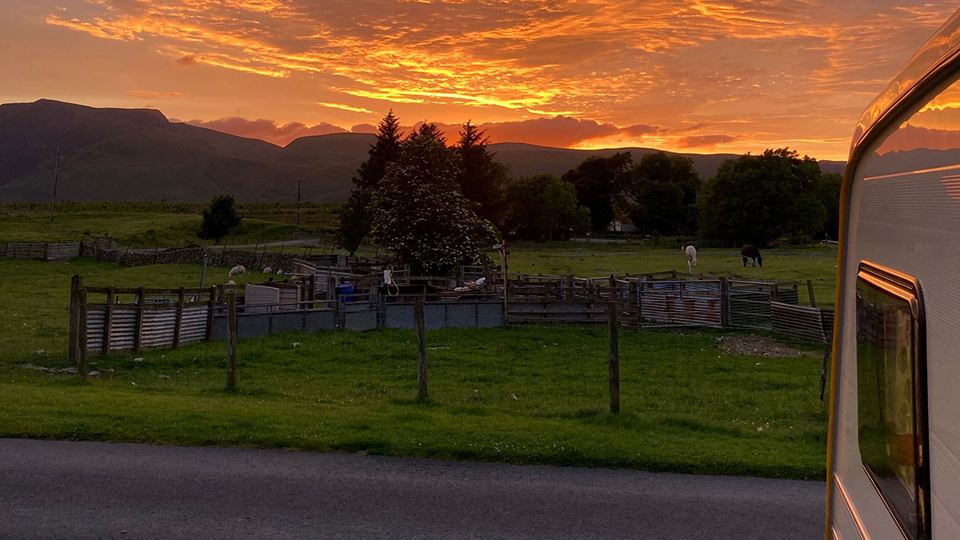Caravans and fence at dusk