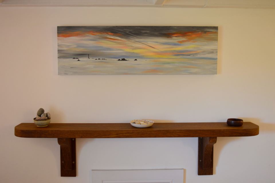 Wall painting above a wooden shelf