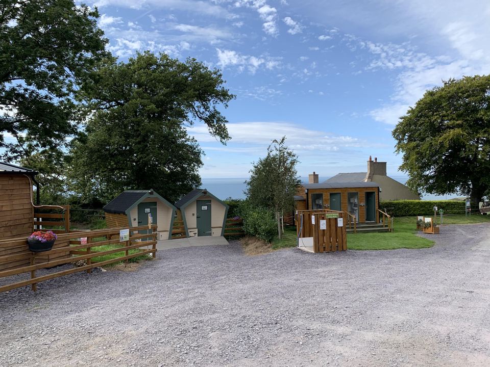 Gravel yard and shower cabins